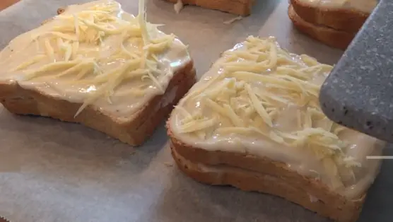 Sprinkle each sandwich with the grated Gruyere Cheese