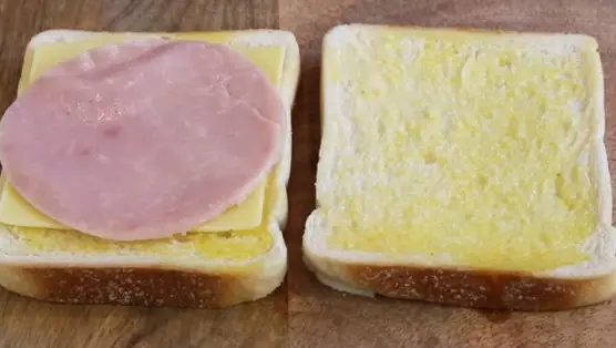 Top bread with ham and cheese