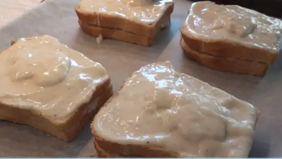 spoon over the tops of the sandwiches with Bechamel Sauce.