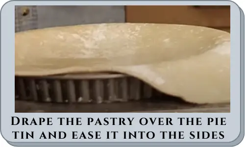 Drape the pastry over the pie tin