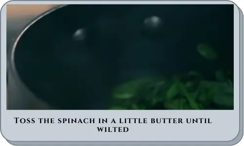 Toss the spinach in a little butter until wilted