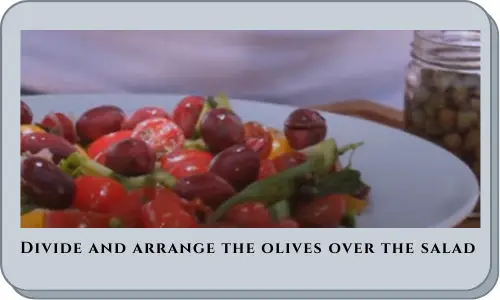 Divide and arrange the olives over the salad